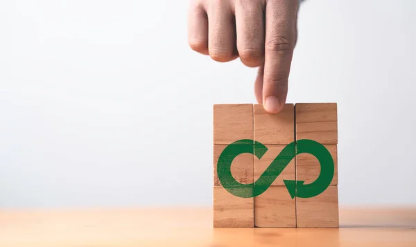 stock image Infinity symbol with Circular business economy environment icons print screen on wooden for future sustainable investment growth and reduce environmental pollution for future concept.