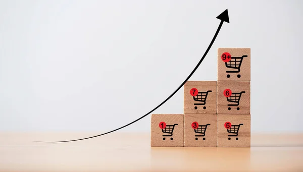 オンライン販売ビジネスとEコマースの成長の概念のためのより大きなショッピングトロリーカートと販売量の傾向グラフの増加 — ストック写真