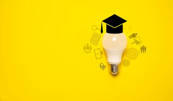 Lightbulb with graduate hat and education icon on yellow background for success study and learning concept.