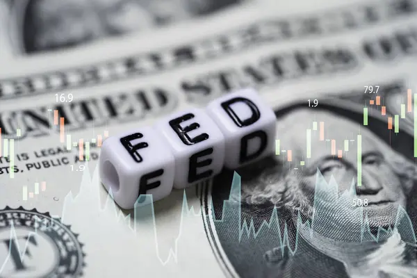 FED wording with stock market chart on USD dollar banknote for Federal reserve increase and decrease interest rate control which effect to America and world economic growth concept.