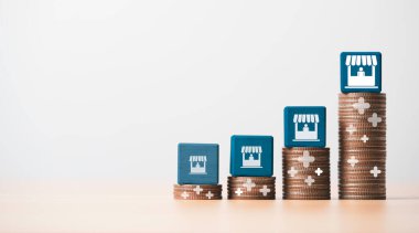 Ticari satış büyümesi ve mağaza imtiyaz konseptini genişletmek, tahta küp bloktaki resimli ekranı depolamak ve artan madeni paraların üzerine uzanmak.