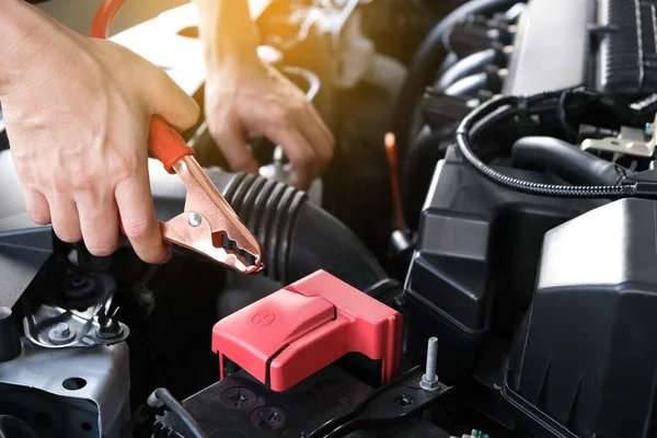 stock image Car maintenance technician He is checking the auto engine, car inspection center.