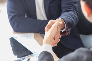 two business men shake hands for business cooperation clipart