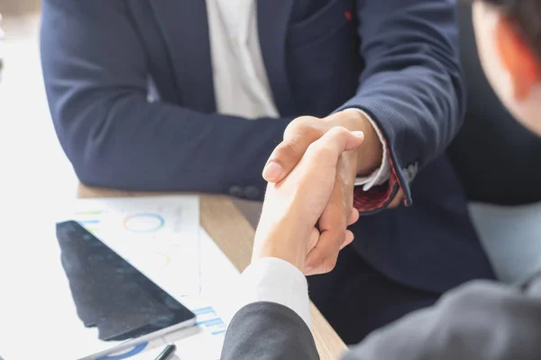 stock image two business men shake hands for business cooperation