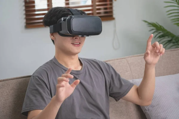 Happy Asian White Man Relaxing Home Playing Virtual Reality Game — стоковое фото