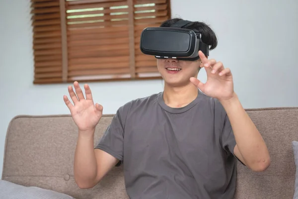 Happy Asian White Man Relaxing Home Playing Virtual Reality Game — стоковое фото