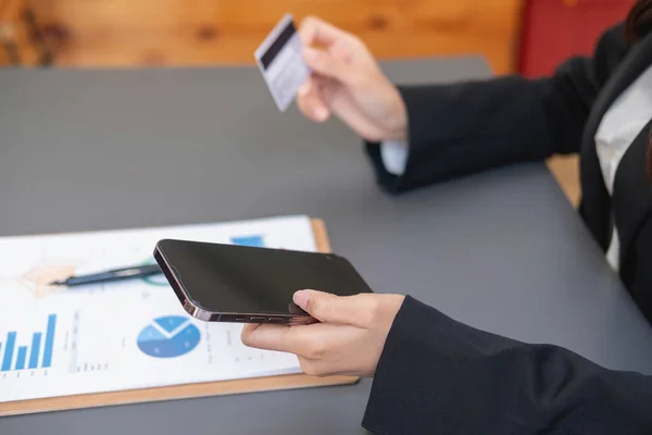 stock image Young Asian woman shopping online using a credit card. for online payment within the house credit card payment concept