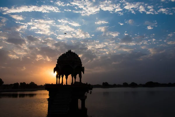 stock image Sunrise at popular tourist destination Gadisar lake in Jaisalmer, Rajasthan, India.