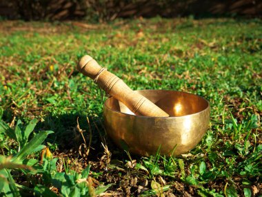 Metal singing bowl for relaxing and receiving healing vibrations clipart