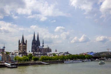 Cityscape of Cologne with Hohenzollern bridge, thedral, Saint Martin church and Rin river in Germany