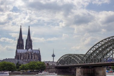 Cityscape of Cologne with Hohenzollern bridge, thedral, Saint Martin church and Rin river in Germany