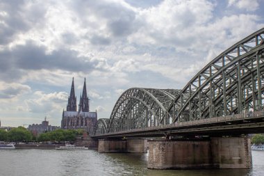 Cityscape of Cologne with Hohenzollern bridge, thedral, Saint Martin church and Rin river in Germany