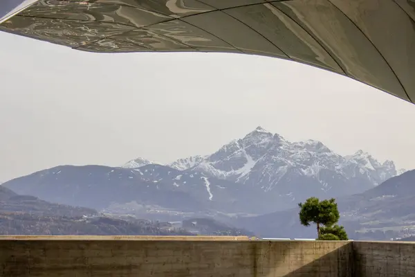 stock image View of mountains range from the Hungerburg station with people looking the city and mountains in Innsbruck, Austria.