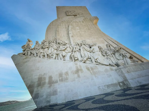 monument to the discoveries, with famous people in the history of Portugal carved in stone, backlight , Belem, lisbon, portugal, wide angle view, horizontal