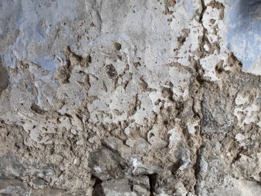 Çürümüş eski bir duvarın dokusu kısmen onarılmış bir döküntü, grunge çatlamış beton duvar, yatay...