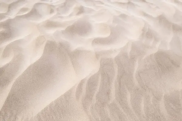 stock image wind patterns on the sand of the beach, texture of a dune with waves made by the action of the wind, background