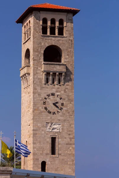 Venetian style bell tower in front of the Greek Orthodox Church in Rhodes against the blue sky. Greece.