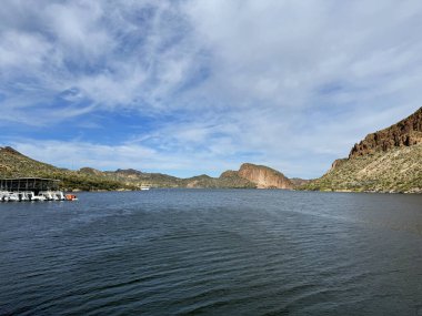 View from a steamboat, of Canyon Lake reservoir, harbor and rock formations in Maricopa County, AZ in the Superstition Wilderness of Tonto National Forest near Apache Trail. The lake was formed by damming the Salt River as part of Salt River Project. clipart