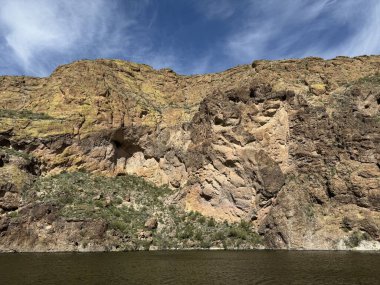 View from a steamboat, of Canyon Lake reservoir and rock formations in Maricopa County, Arizona in the Superstition Wilderness of Tonto National Forest near Apache Trail.  The lake was formed by damming the Salt River as part of Salt River Project. clipart