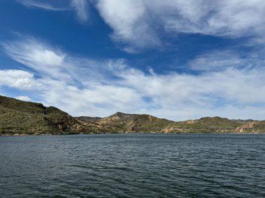 View from a steamboat, of Canyon Lake reservoir and rock formations in Maricopa County, Arizona in the Superstition Wilderness of Tonto National Forest near Apache Trail. The lake was formed by damming the Salt River as part of Salt River Project. clipart