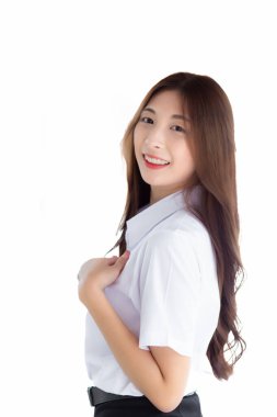 Asian Portrait of an adult Thai student in university student uniform. Young Asian beautiful girl standing confidently isolated on white background.