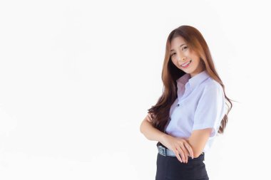 Portrait of an adult Thai student in university student uniform. Asian cute girl standing with her arms crossed confidently isolated on white background.