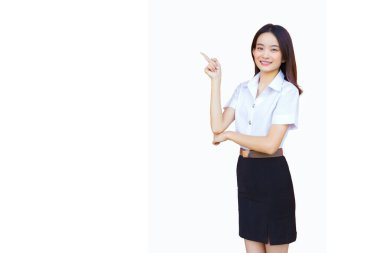 Portrait of an adult Thai student in university student uniform. Asian beautiful girl standing to present something confidently while isolated white background. clipart