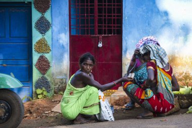 Bastar, Chhattisgarh, India / November 25, 2021: Tribal women at Haat (weekly) market. 