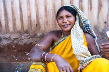 Bastar, Chhattisgarh, India / November 25, 2021: Portrait of a tribal woman at Haat (weekly) market.