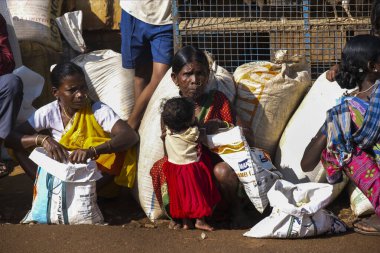Bastar, Chhattisgarh, India / November 25, 2021: Tribal women at Haat (weekly) market. 