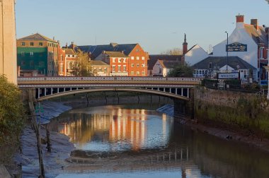 View of the old town bridge on the river Haven with the Moon Under the Water Wetherspoons pub at sundown in Boston Lincolnshire