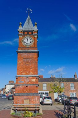 The clock tower in the Wainfleet town marketplace on a sunny day