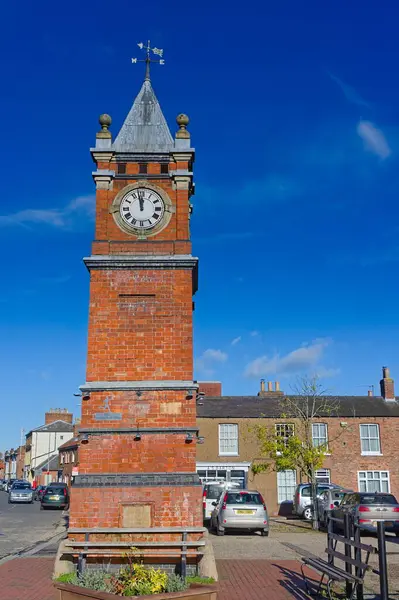The clock tower in the Wainfleet town marketplace on a sunny day