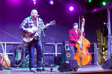 rockabilly band Relentless performing on stage at the Christmas Market in Boston Lincolnshire