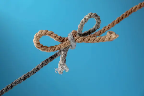 Zwei Seile Grau Und Braun Einem Bogen Zusammengebunden Konzept Für Stockbild