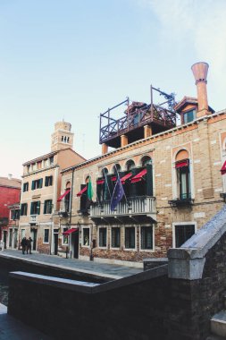Traditional view of a street in Venice, Italy. Panorama of Venice on a sunny summer day. Old houses on the water on Grand Canal in Venice.