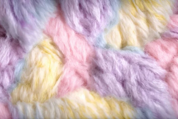 Looking for the perfect image to add a touch of warmth and softness to your project? Look no further than this stunning shot of multicolored wool texture. This fluffy, delicate, and airy wool fills the frame, inviting you to reach out and touch its l
