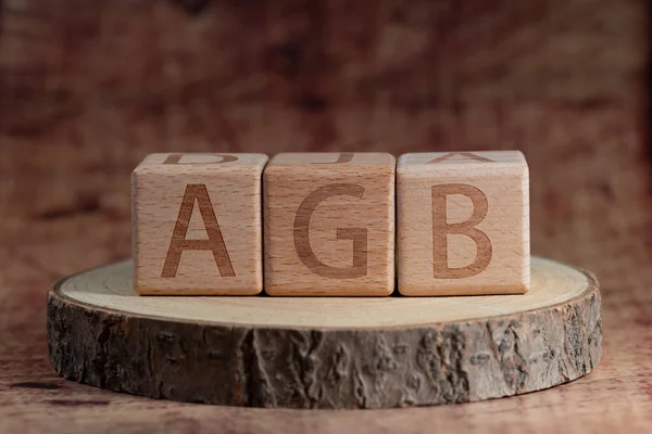 Cubes with the inscription AGB, General terms and conditions