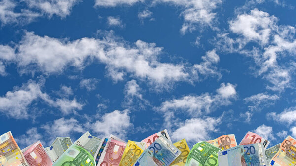 Many banknotes in front of a cloudy sky