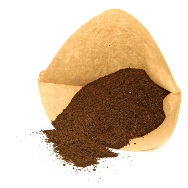 stock image Filter bag with coffee grounds against a white background