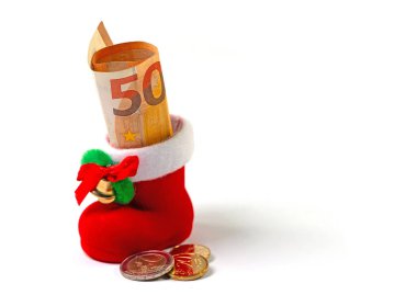 Santa's boot with banknote against a white background clipart