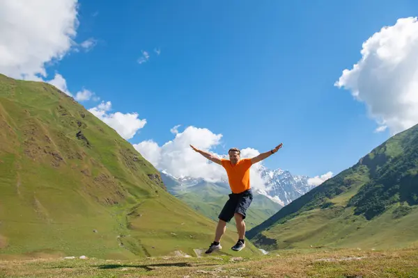 Clouds Orange Shirted Man Takes Flight Green Mountains High Quality Royalty Free Stock Photos