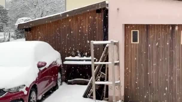 Snowflakes Gently Descending Tranquil Suburban Setting Snow Covered Car Shed Royalty Free Stock Video