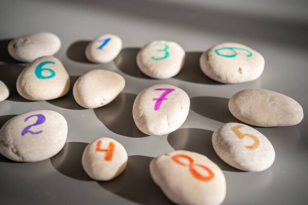 Colorful stones signed by numbers, an alternative method of children education. Number 7 in center. High quality photo