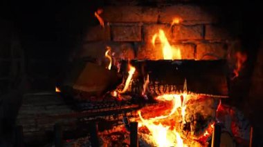 Close up view of a fireplace fire burning. High quality 4k footage