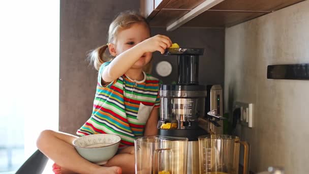 Little Girl Making Fresh Juice Sitting Table Home Kitchen High — Vídeos de Stock