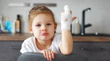 Little girl with broken finger at the doctors appointment in the hospital. High quality 4k footage