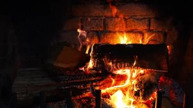 Close up view of a fireplace fire burning. High quality 4k footage