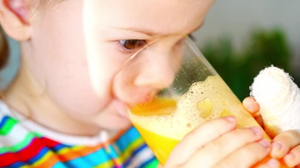 Little Girl Drinking Fresh Juice Sitting Table Home Kitchen High — Stockvideo