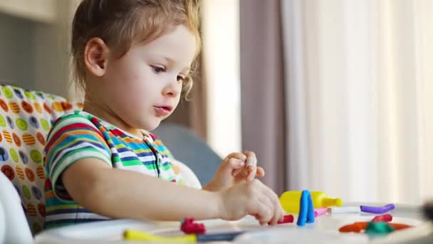 Little Girl Plays Multi Colored Plasticine Creates Different Shapes High — Vídeos de Stock